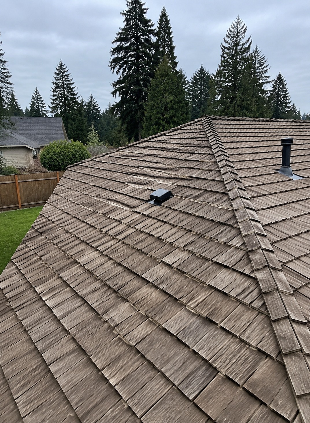 Weathered cedar shake roof on a home in Gresham, Oregon