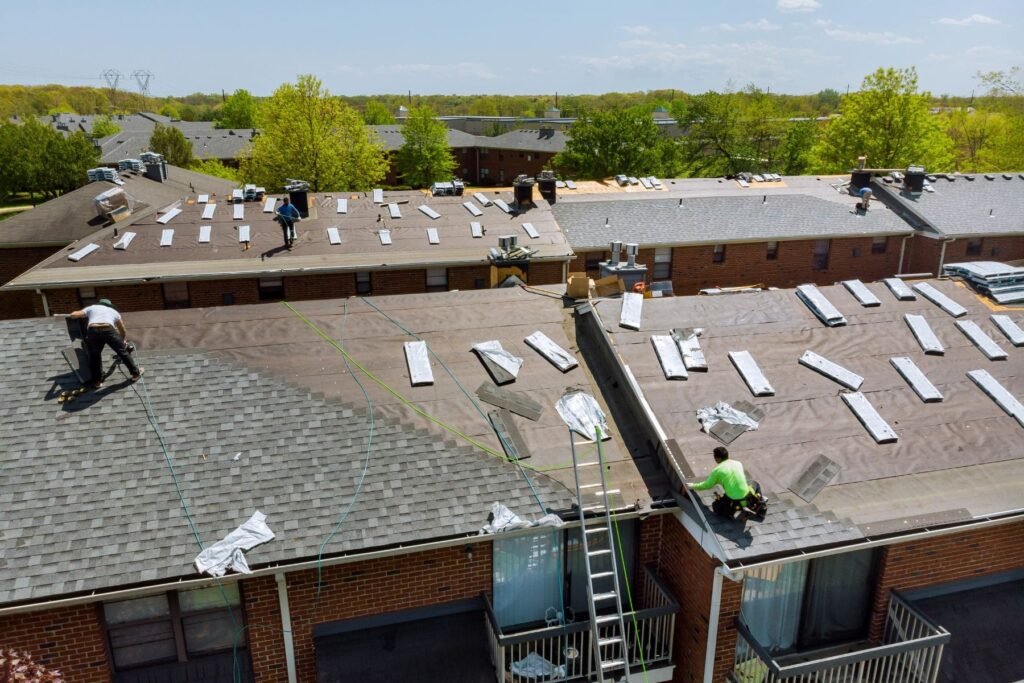 Roofing team completing a flat roof restoration in Gresham, Oregon